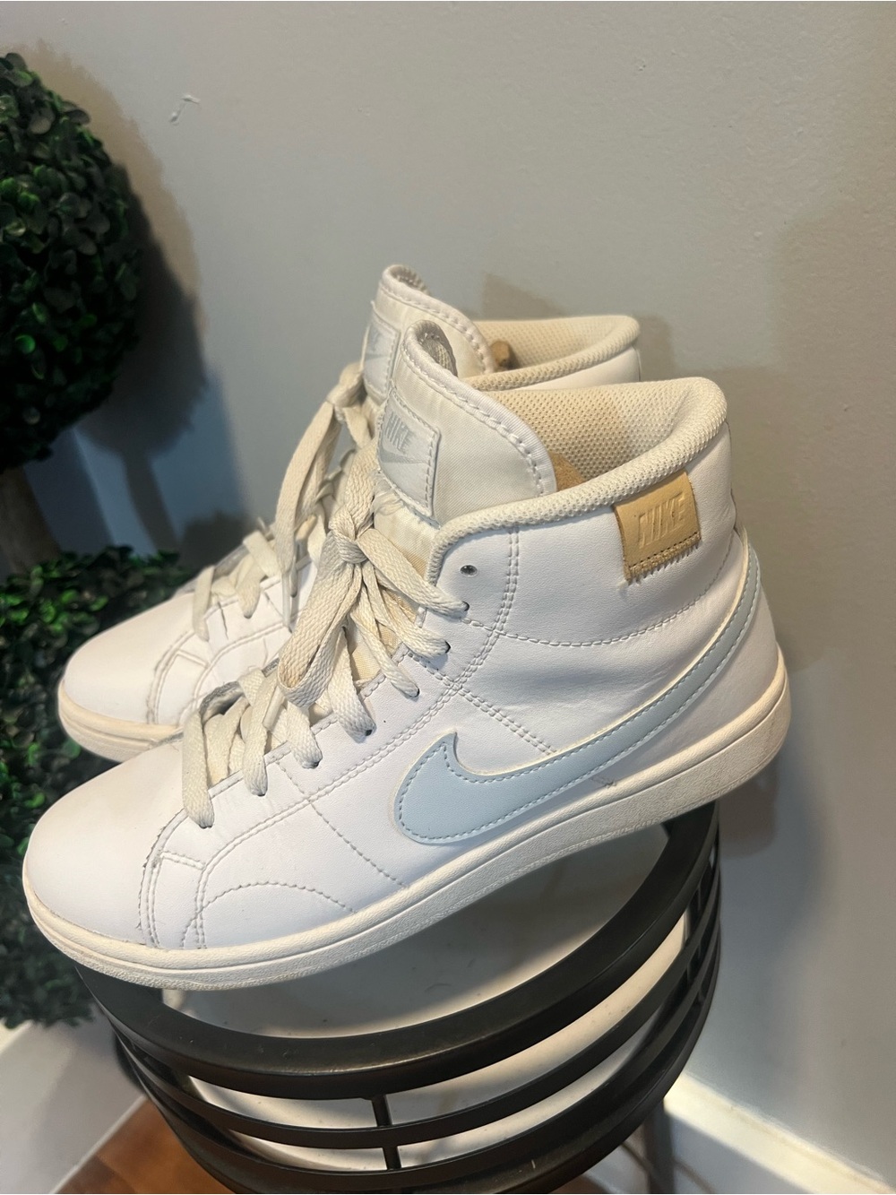Nike Women's White High-Top Sneakers with Light Blue Swoosh and Tan Badge